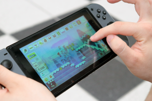 Student uses Nintendo Switch gaming device to practice computational skills
